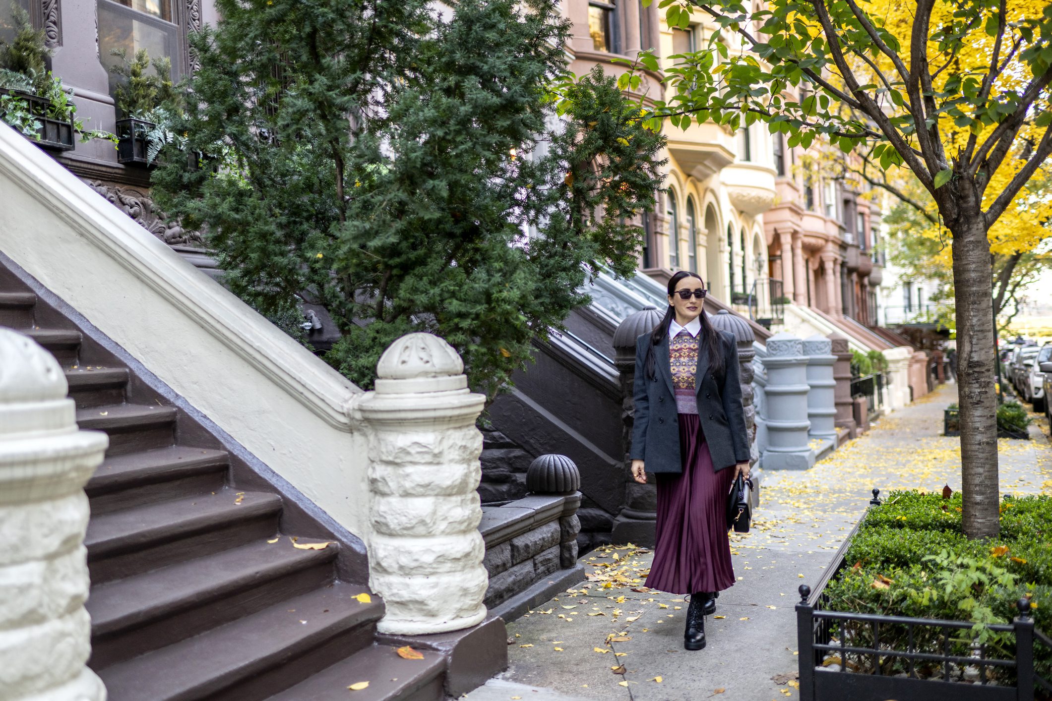 Woman walking down urban city block